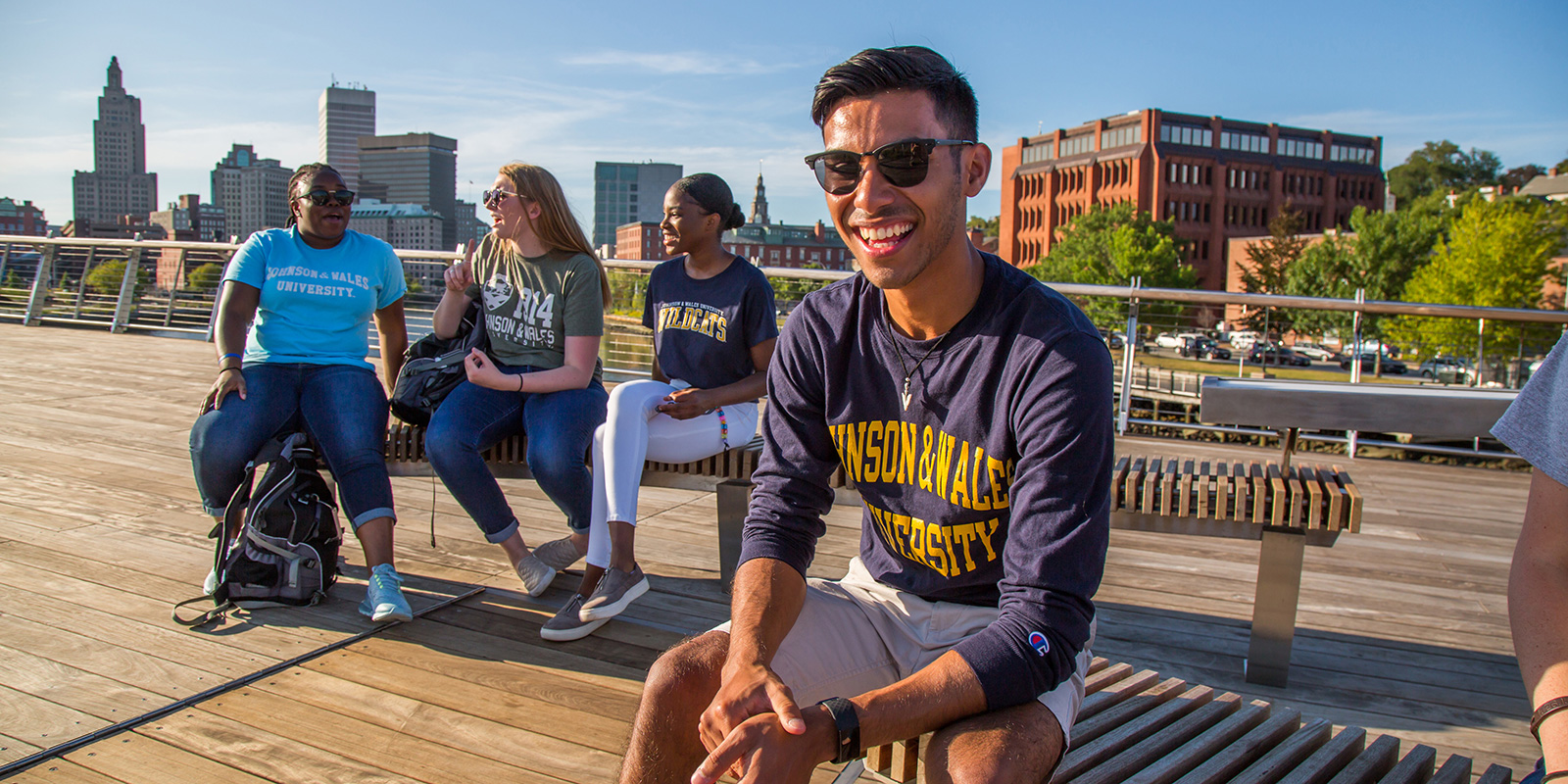 Admissions and Aid - Female and male Students enjoying the city around campus