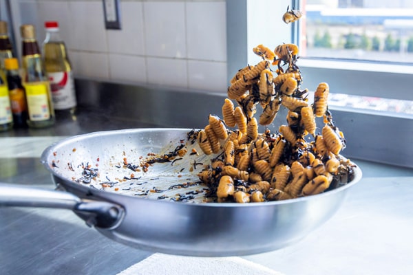 Tossing gnocchi during a cooking class.