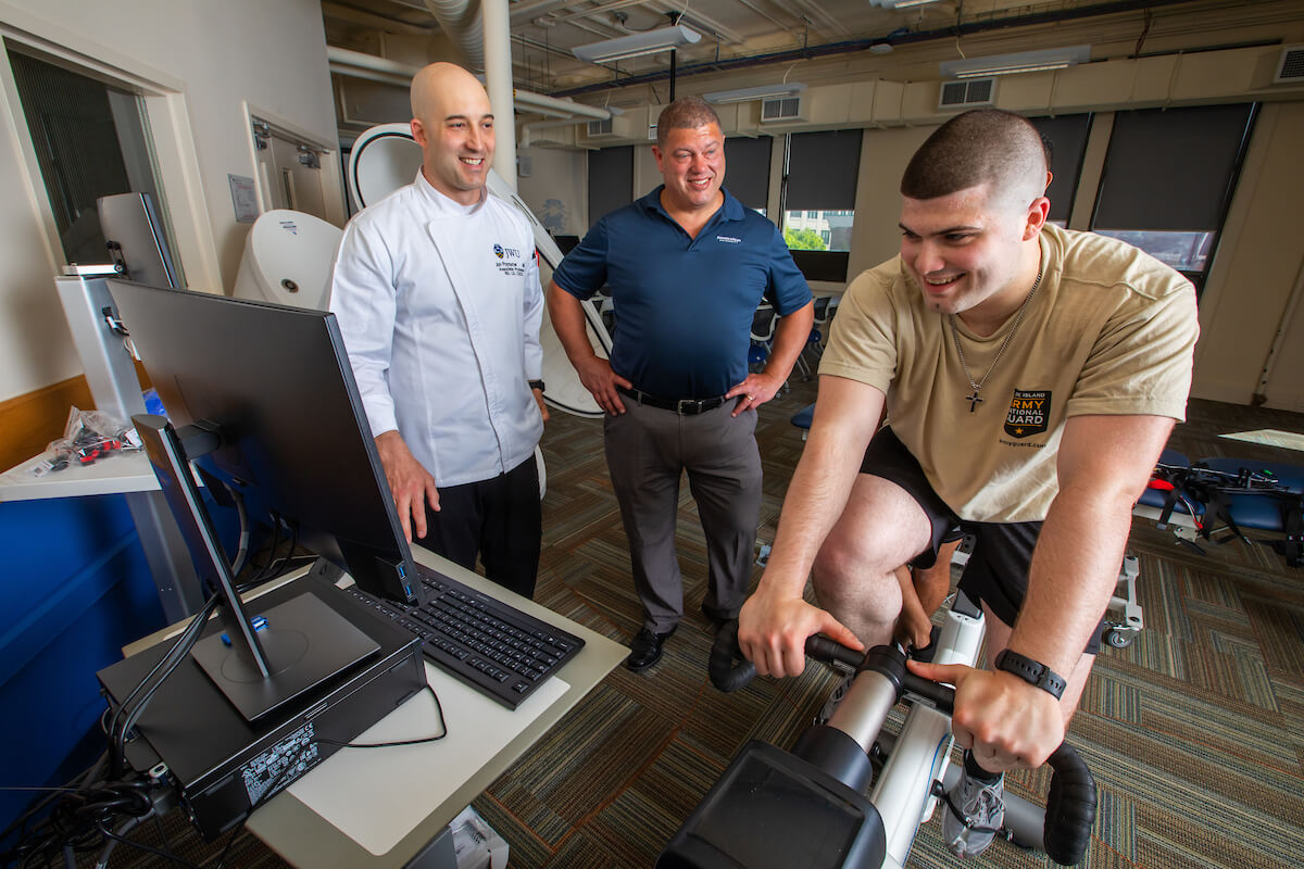 young male on aerobics bike in exercise science lab