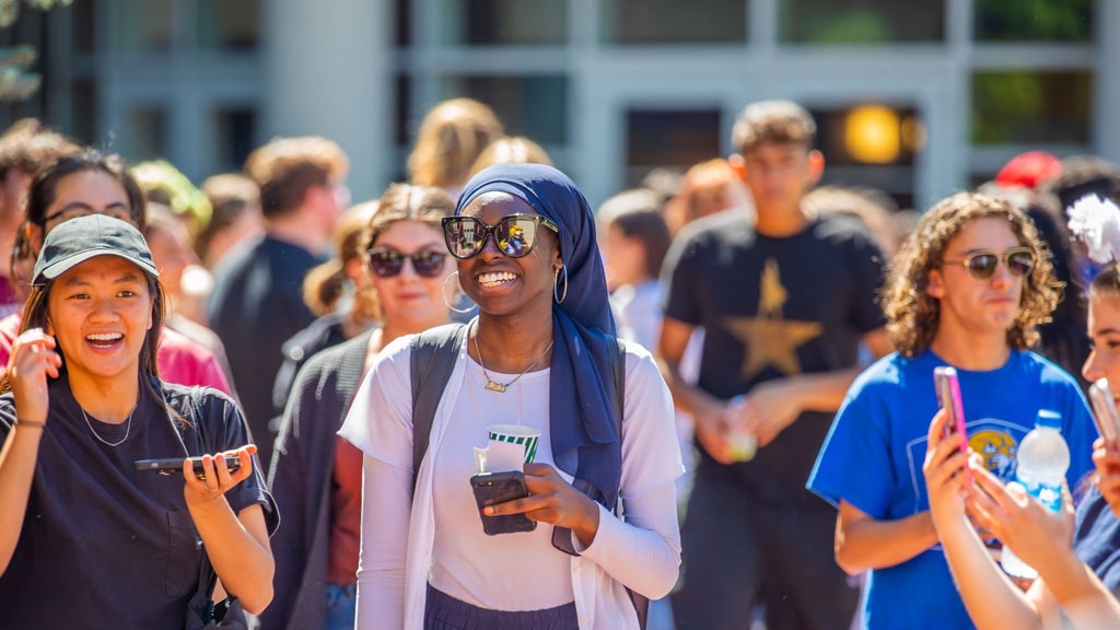 JWU undergrads walking in a row.