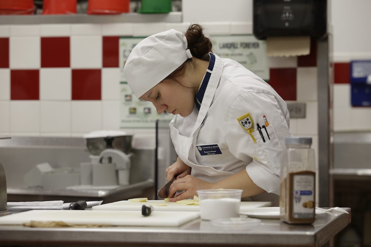 A student preparing a meal