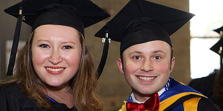 Happy friends at commencement.