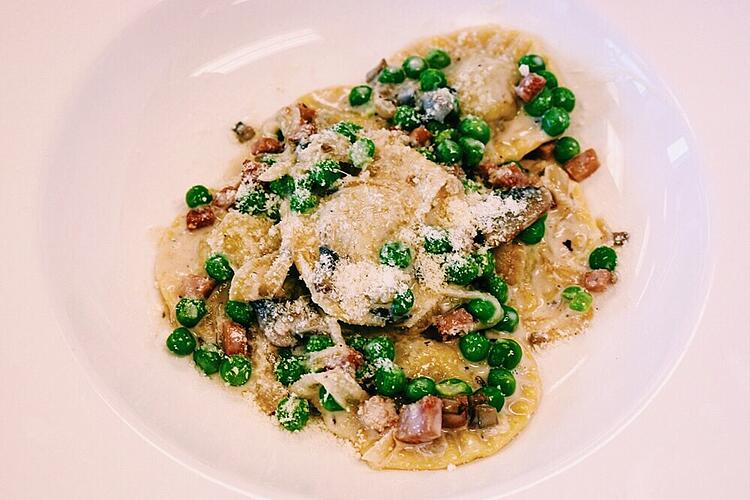 Making mushroom ravioli in pasta skills class.