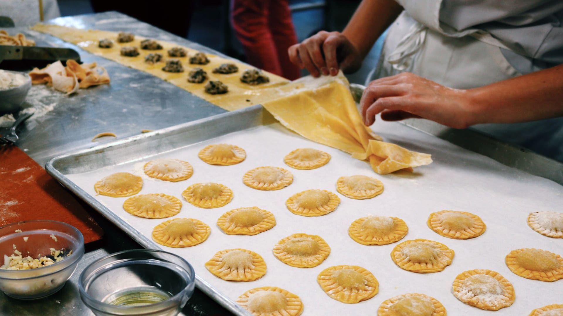 Making mushroom ravioli in pasta skills class.