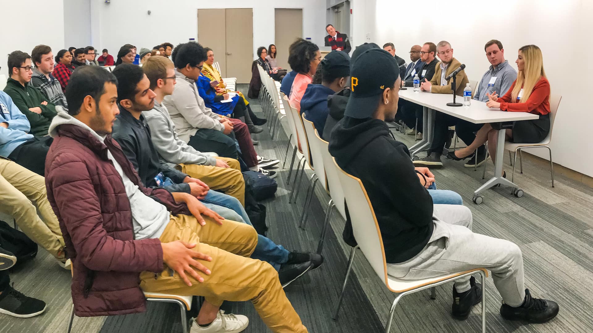 Students listening to panel members.