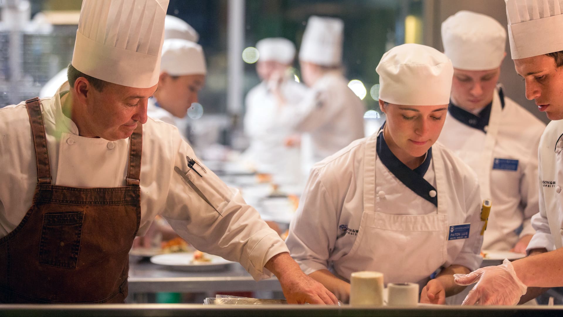 Chef Tom Condron '88 plating with students.