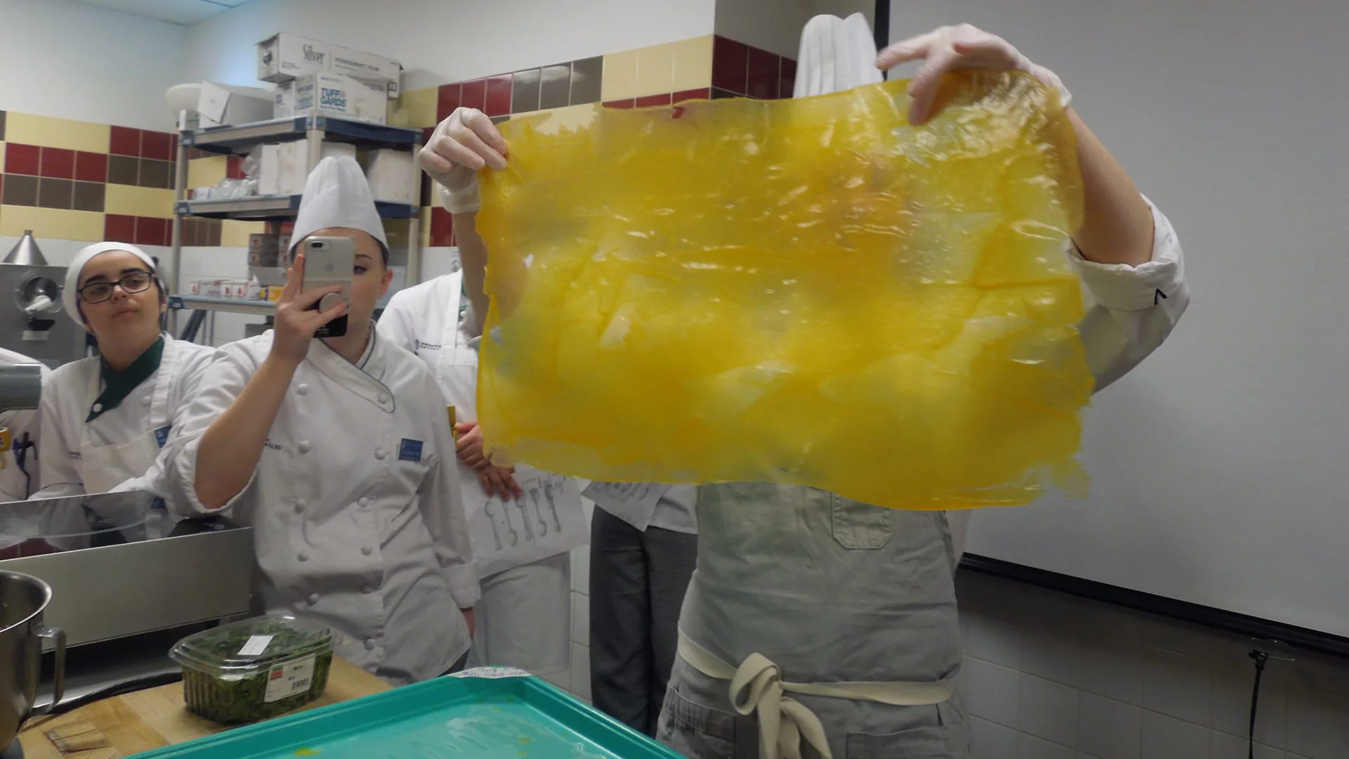 JWU alum Jaime Schick '07 teaching a plated desserts demo for the Pastry Arts Club.