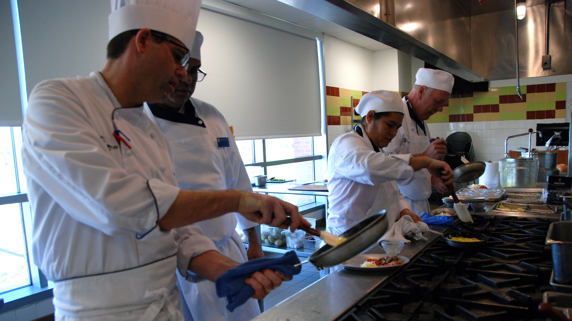 Chef Matthew Britt in the kitchen with students