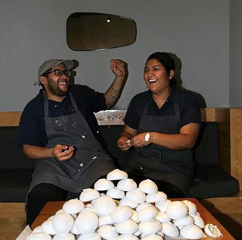 Josh Ulmer ’17 and Cosme pastry chef Isabel Coss plate up tasting portions of the James Beard Award-winning restaurant’s corn husk meringue.