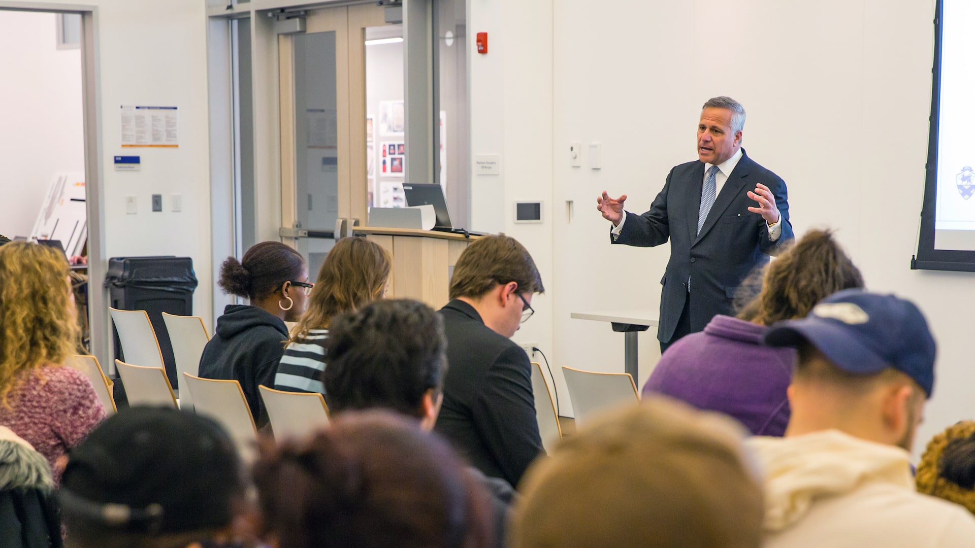 Paolino speaking to class.