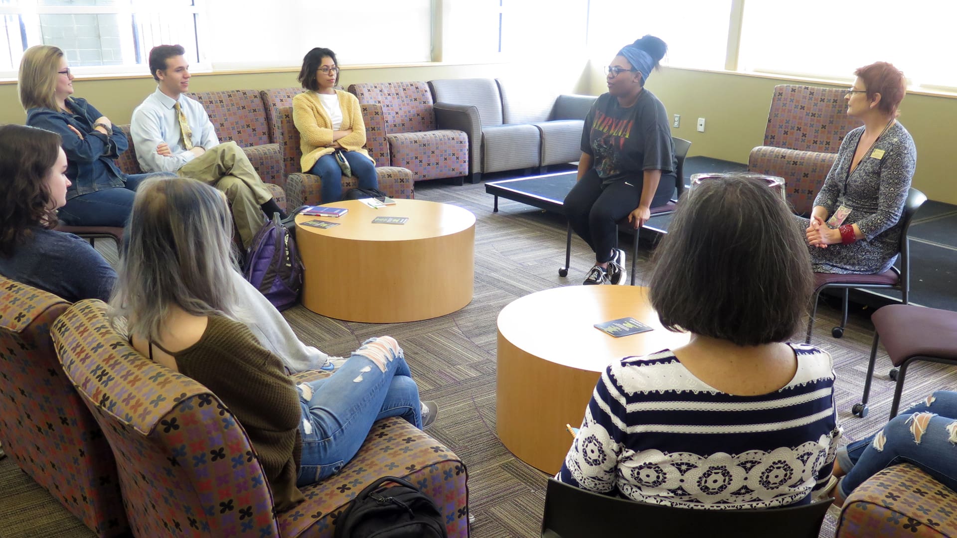 Professor Lisa Kendall listens as students share their stories.