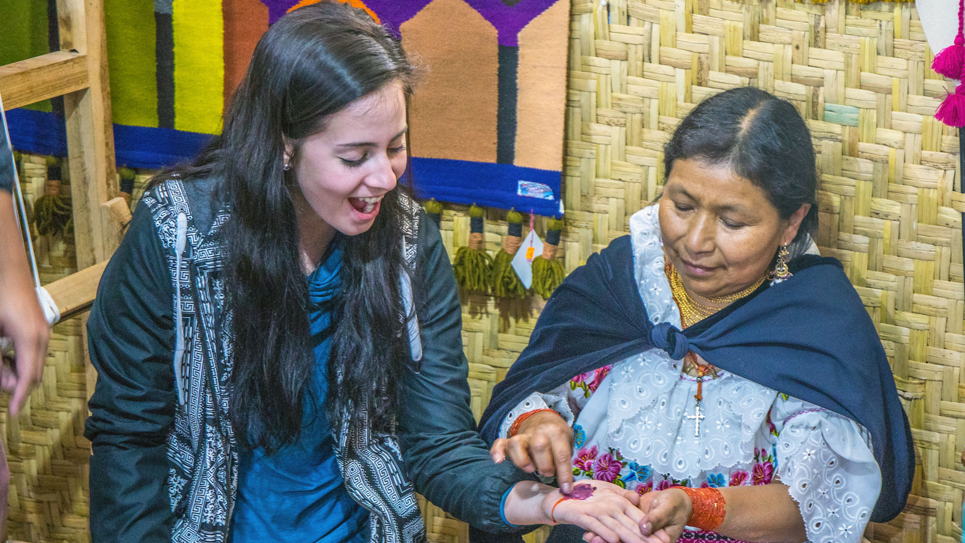 A local textile creator shows Rachel Saffell one of the dye pigments she uses in her work