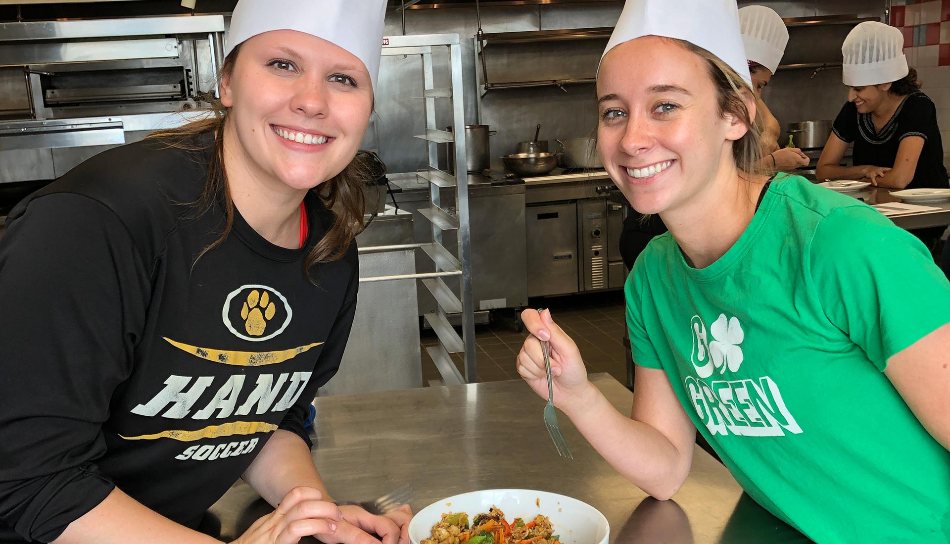 Students posing with finished stir fry