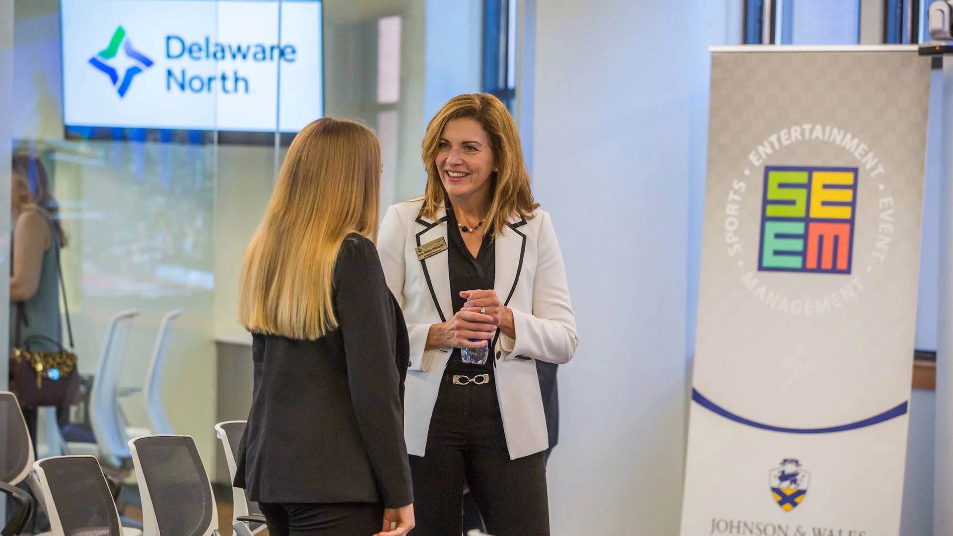 President Marie Bernardo-Sousa chats with Rita Ellis.