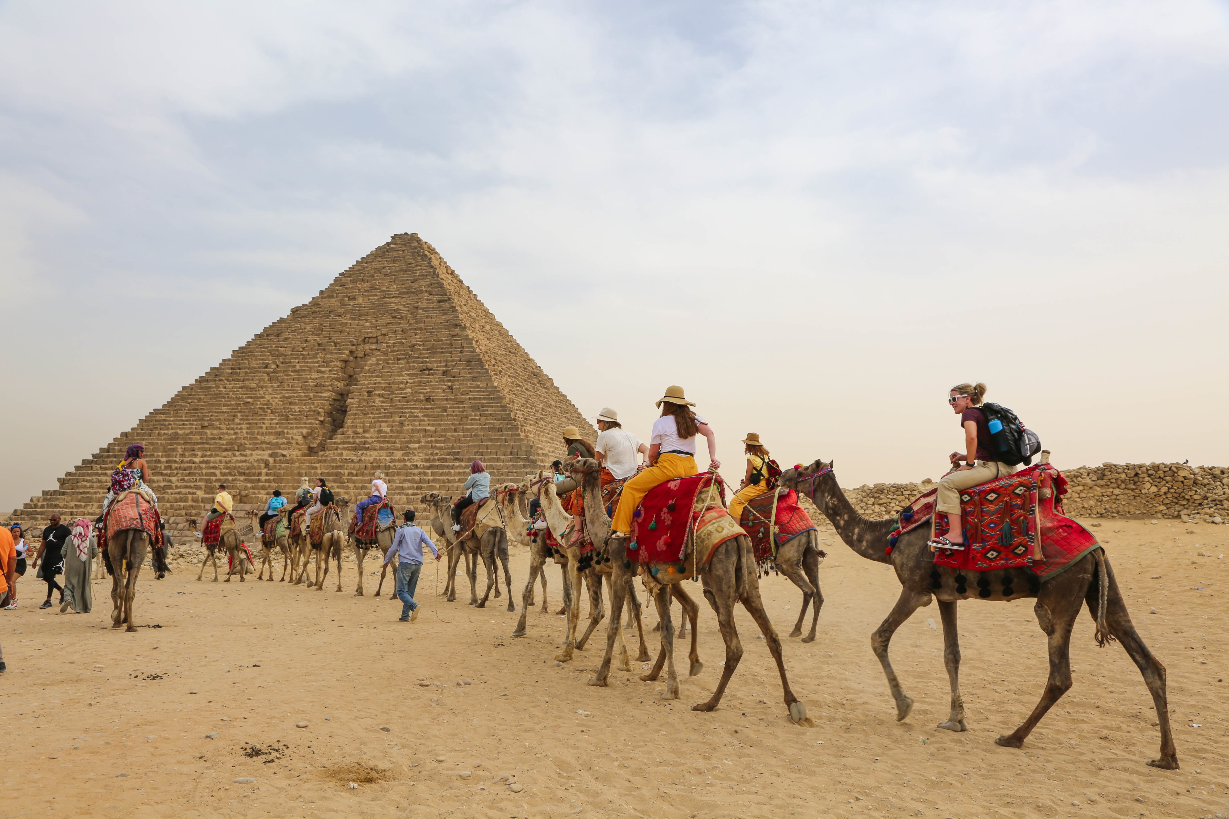 JWU students on camels near the pyramids.