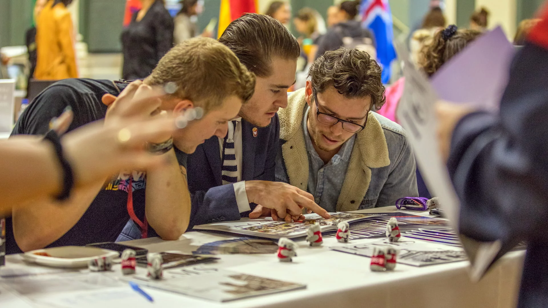 Students looking at Study Abroad brochures