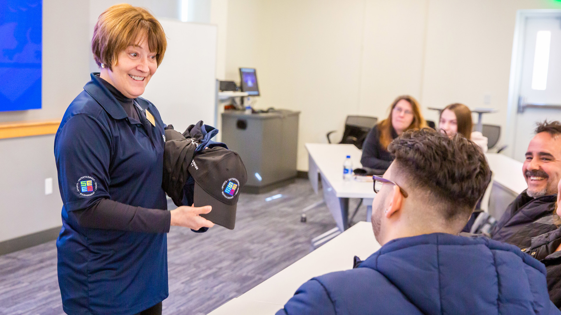 Associate Professor Brenda Eckler talks to students and families about the sports, entertainment and events management fields.