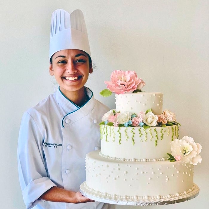 Alex Milano portrait with cake