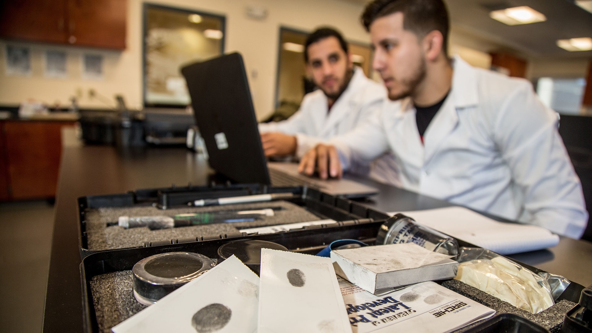 Two students assess data in the Criminal Justice lab.