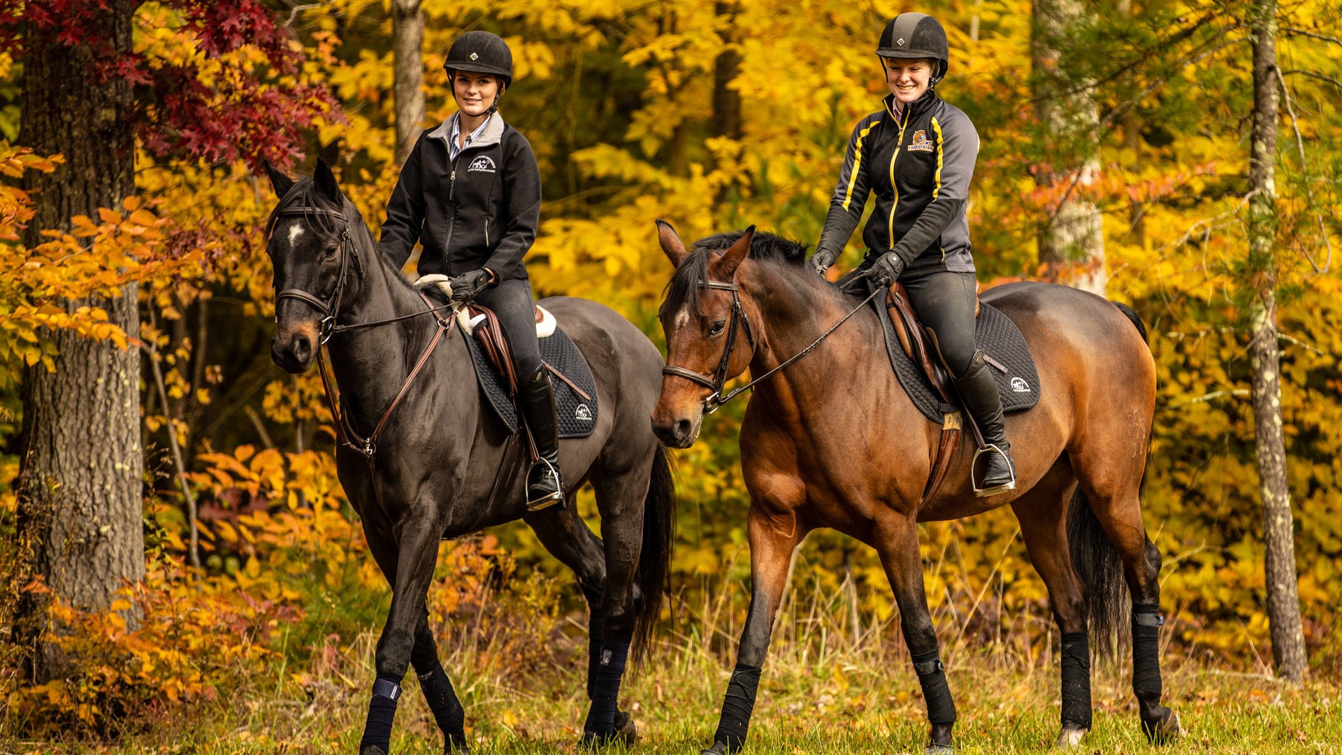 Two Equine students riding horses