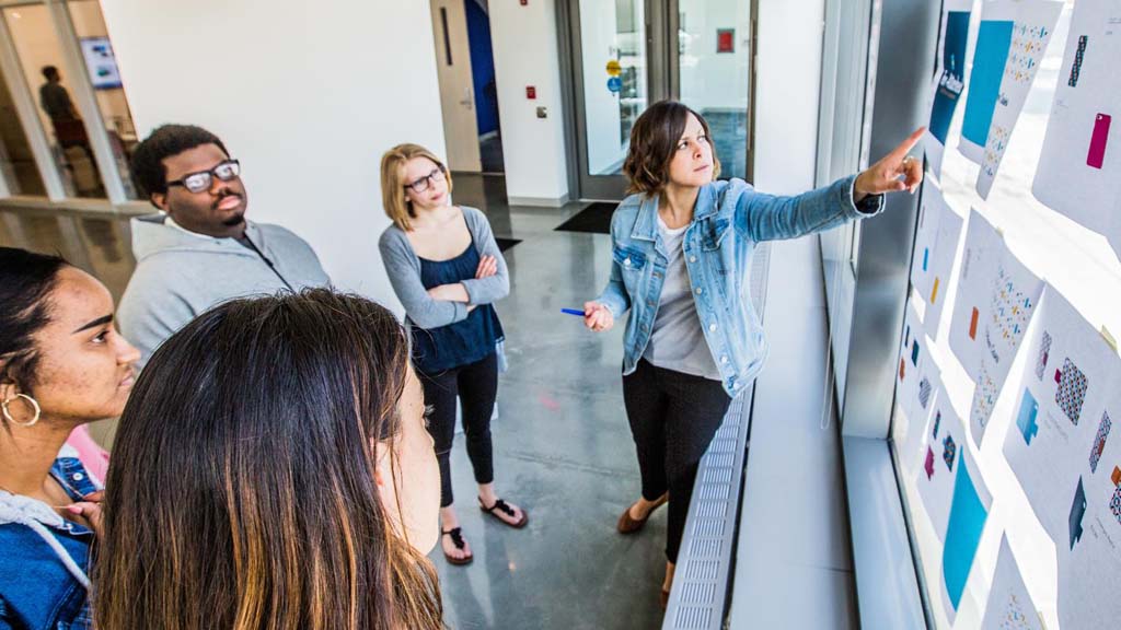 Karyn Jimenez-Elliott (right) teaching a design class at JWU.