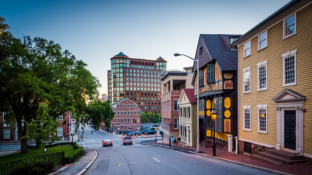 Image of road in Providence on Colleg Hill. Houses displayed on the right of the image.