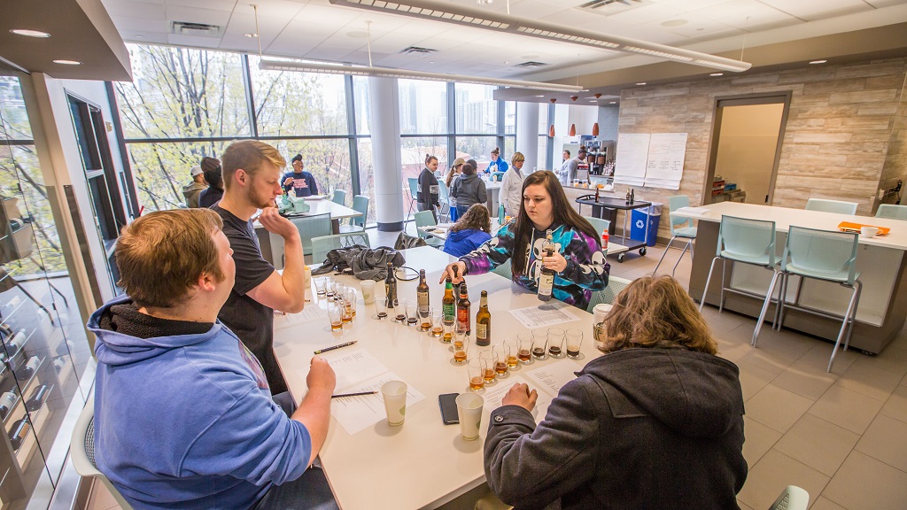 Students conducting tasting in Beverage Lab