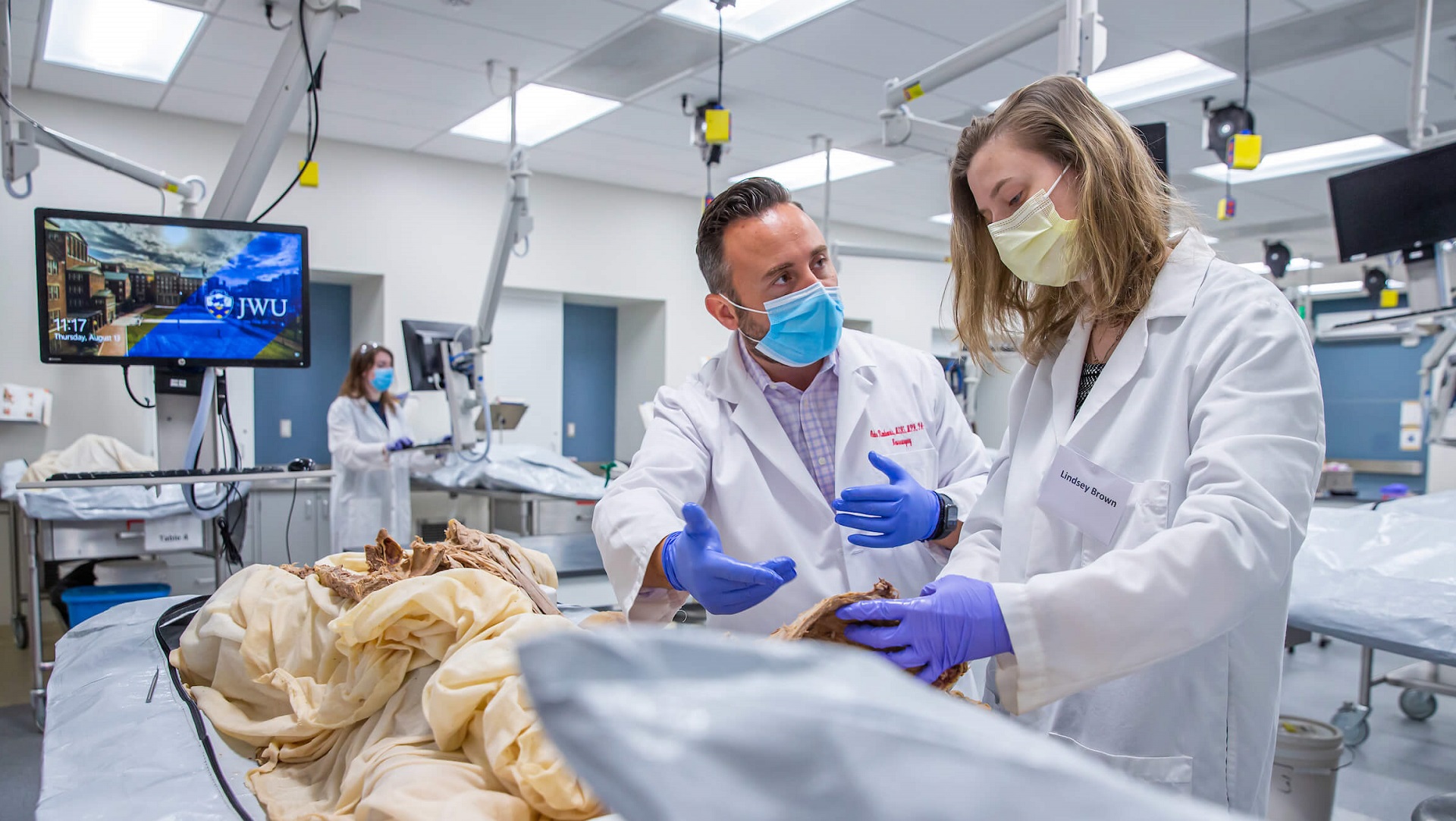 Physician assistant student learning in the patient care lab