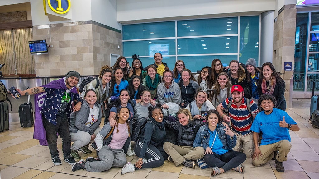 a group of JWU Hospitality Familiarization (FAM) Tour pausing for a photo on their 2019 trip to Ecuador