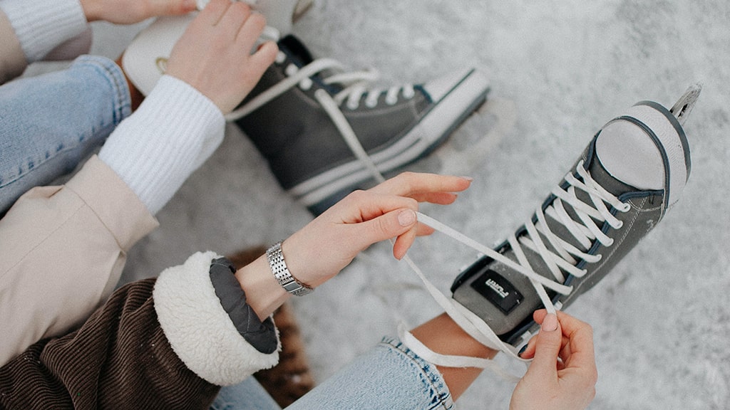 Person tying up their ice skates