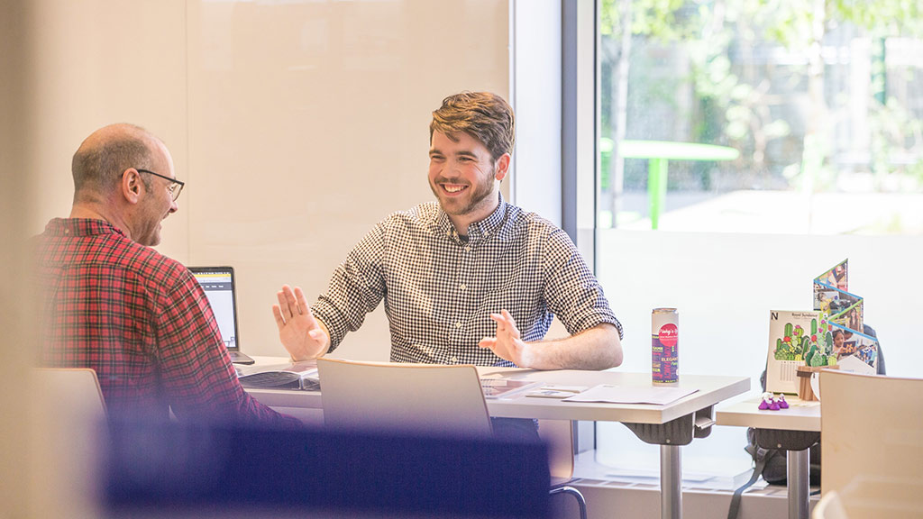 A student and a professor having a conversation