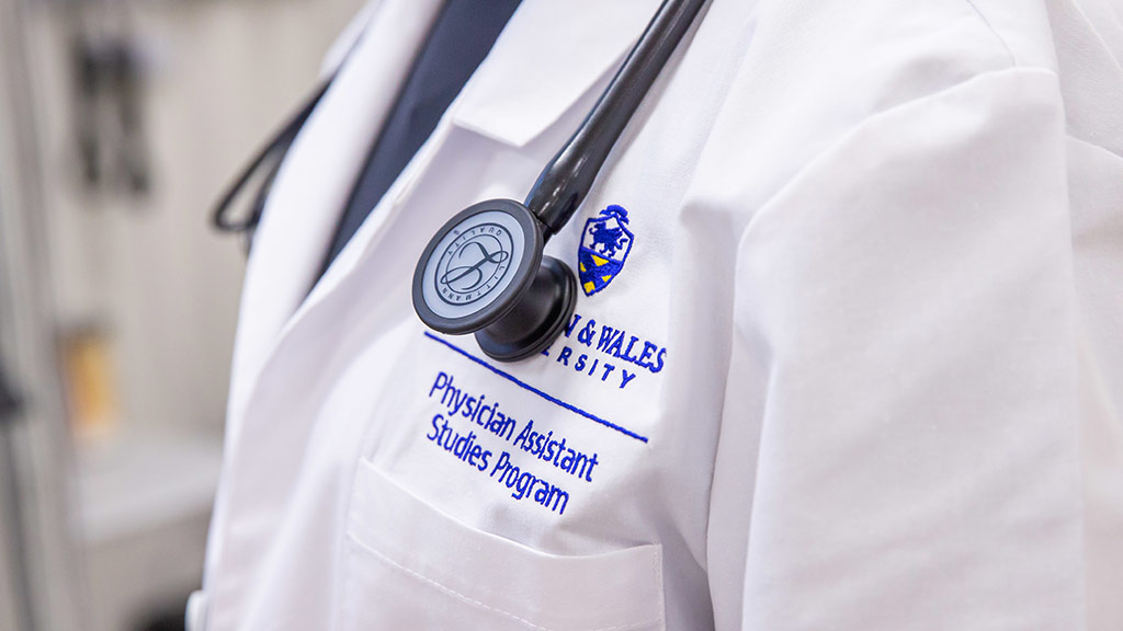 Upclose of a JWU PA white coat