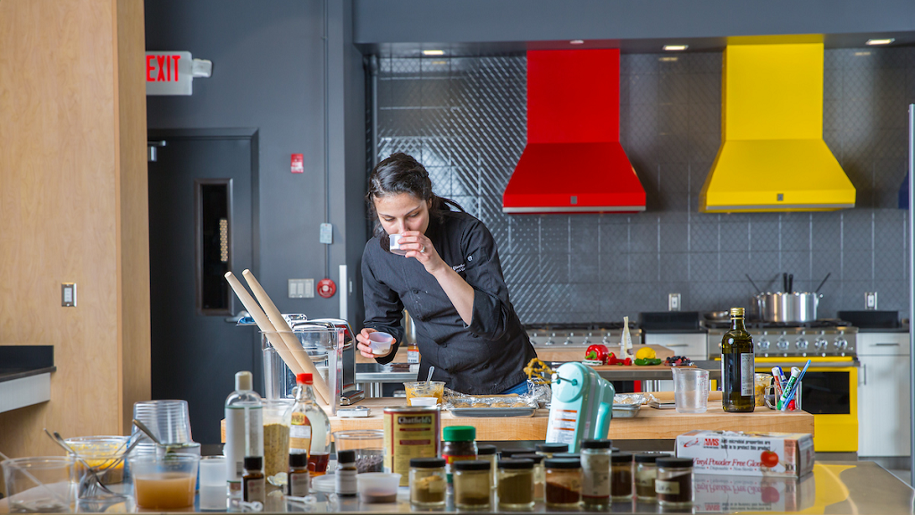 culinary student baking in culinary lab