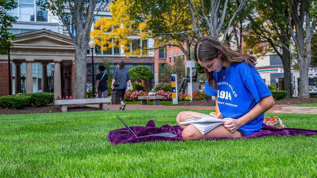 Student Outside Gaebe Studying