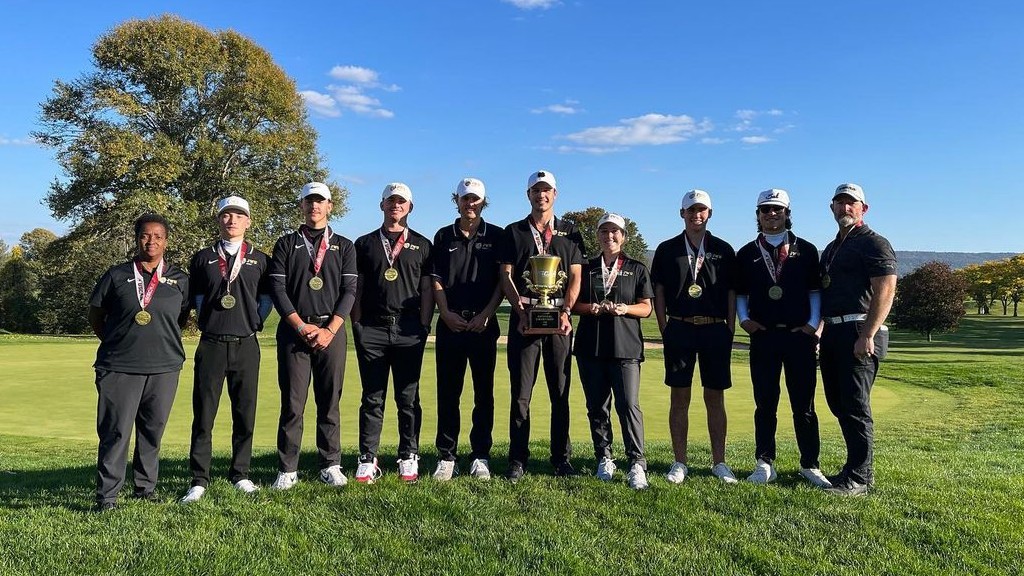 Charlotte golf team holding awards