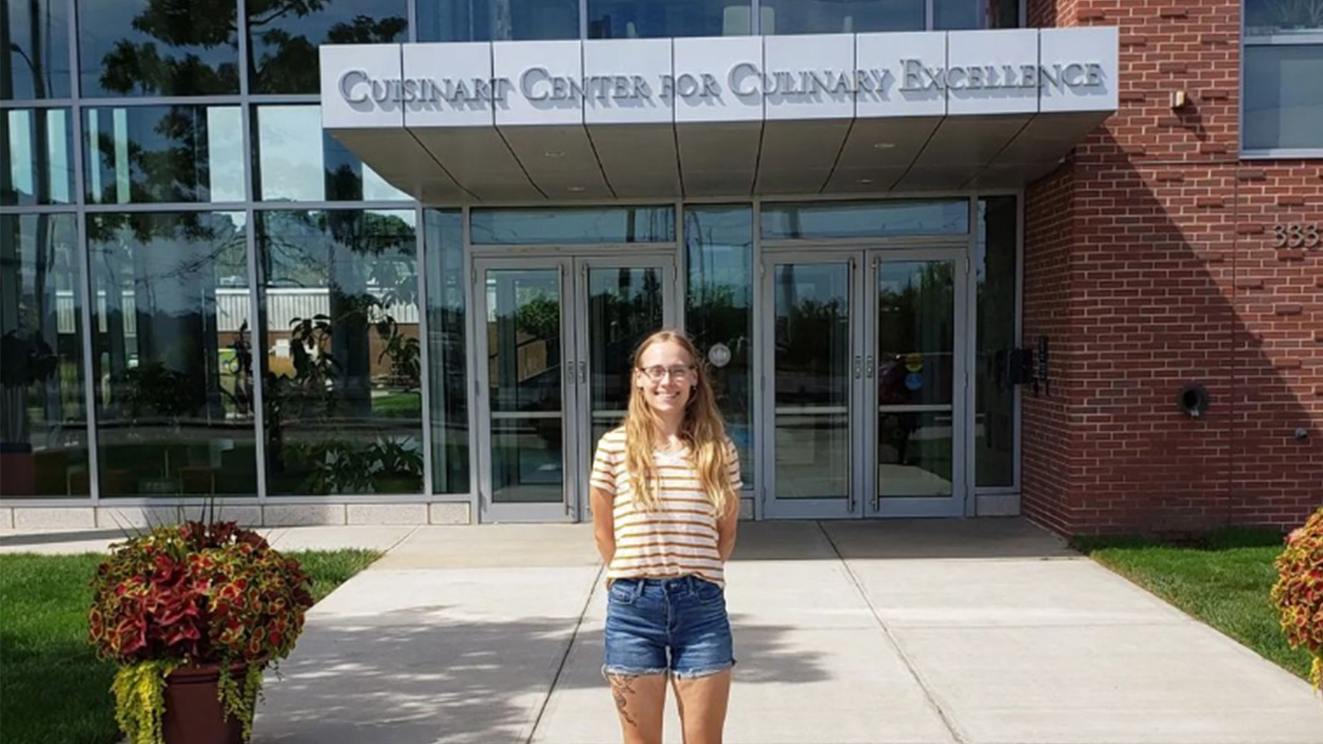 Sasha Joseph in front of the Cuisinart Center for Culinary Excellence