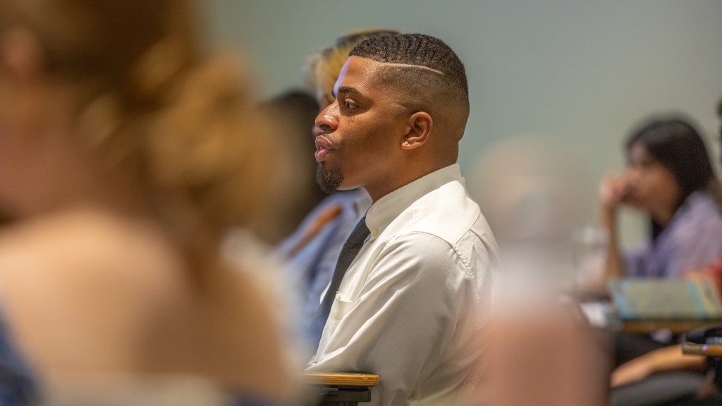 male student in classroom