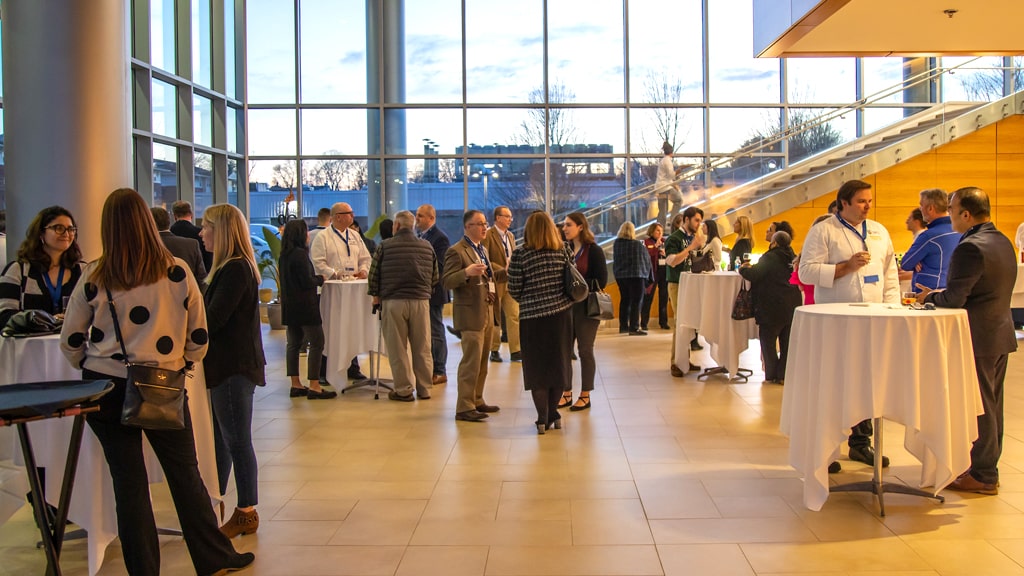 Socializing before the start of JWU Providence’s 2023 FIT Symposium.