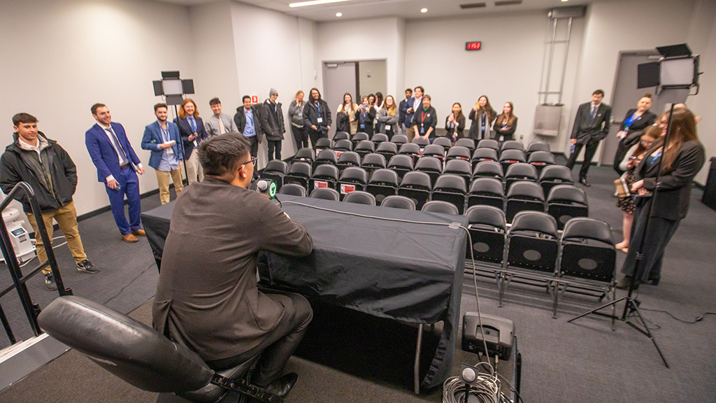 Students in the TD Garden press conference room