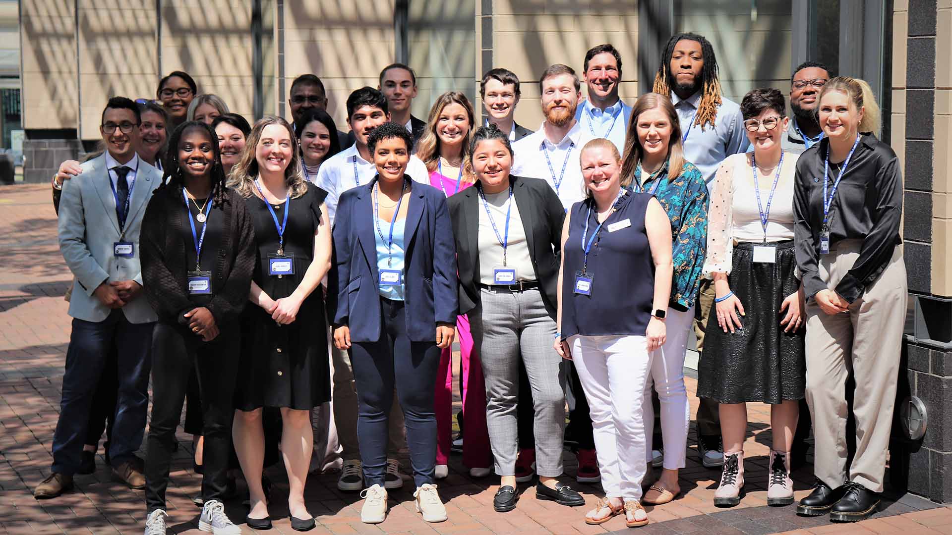 A group of students standing in front of a building