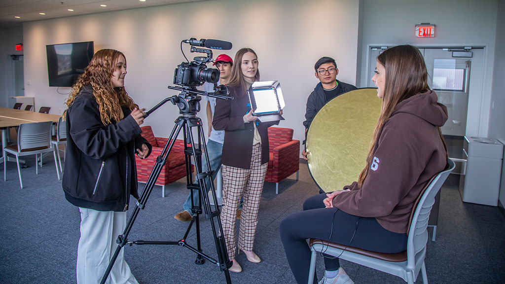 Students recording a student sitting down talking