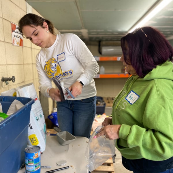 JWU Serves volunteers organizing the raw materials for making dog toys.