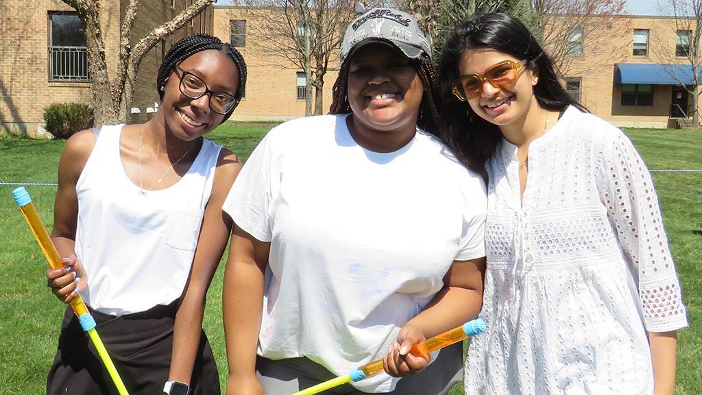 three female students posing for JWU's little india club 