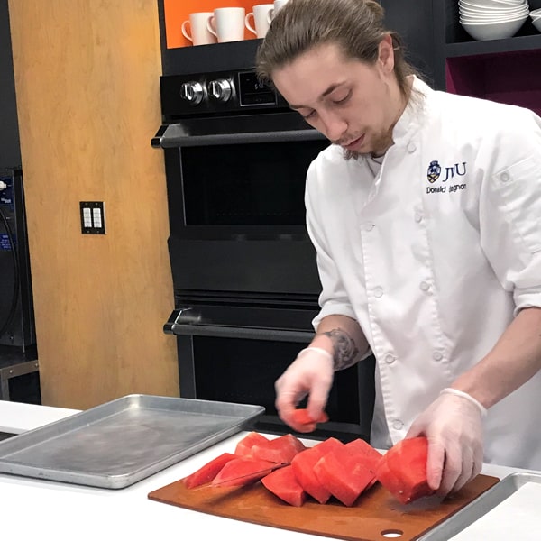 Donald Gagnon prepping the watermelon planks.