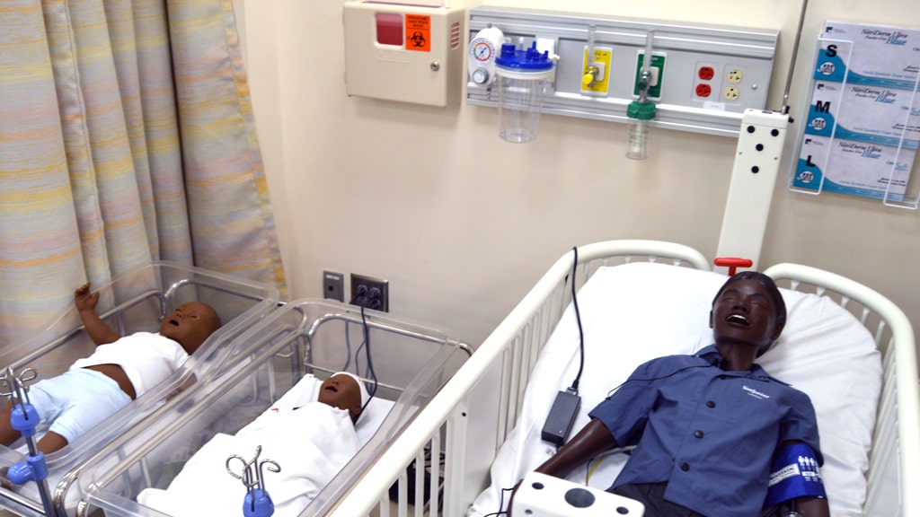 Newborn and pediatric simulation manikins in the Charlotte nursing lab.