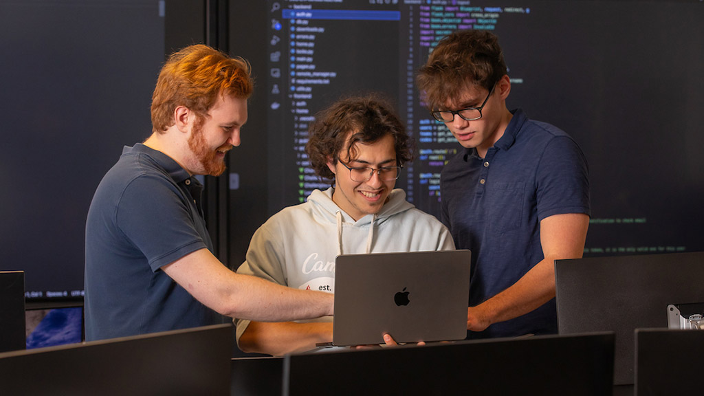 Students working with a laptop