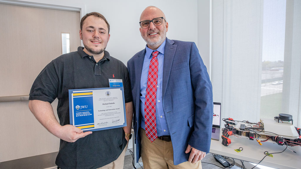 photo of Michael Dattolo ’24 posing with Provost Rich Wiscott