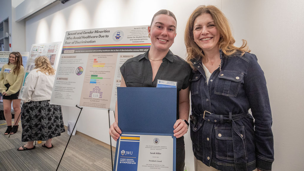 photo of Sarah Miller '24 posing with JWU Providence Campus President Marie Bernardo-Sousa