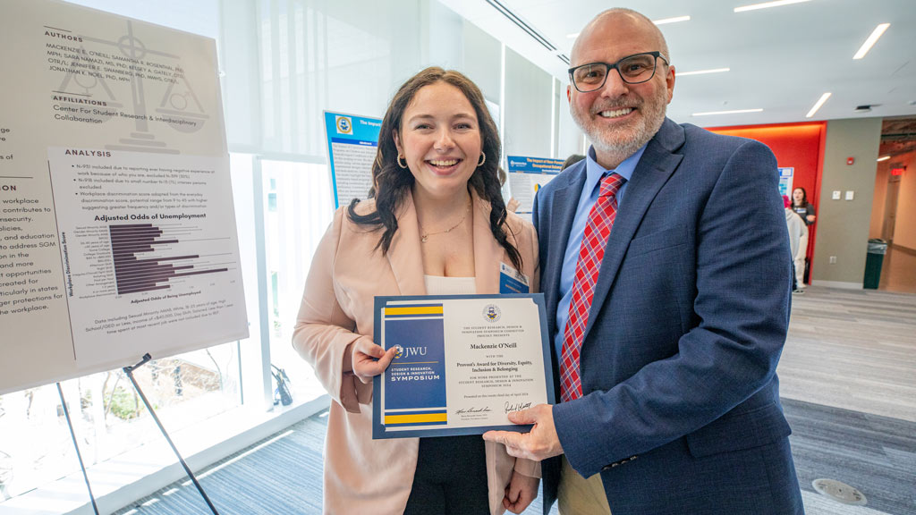 photo of Mackenzie O'Neil posing with Provost Wiscott