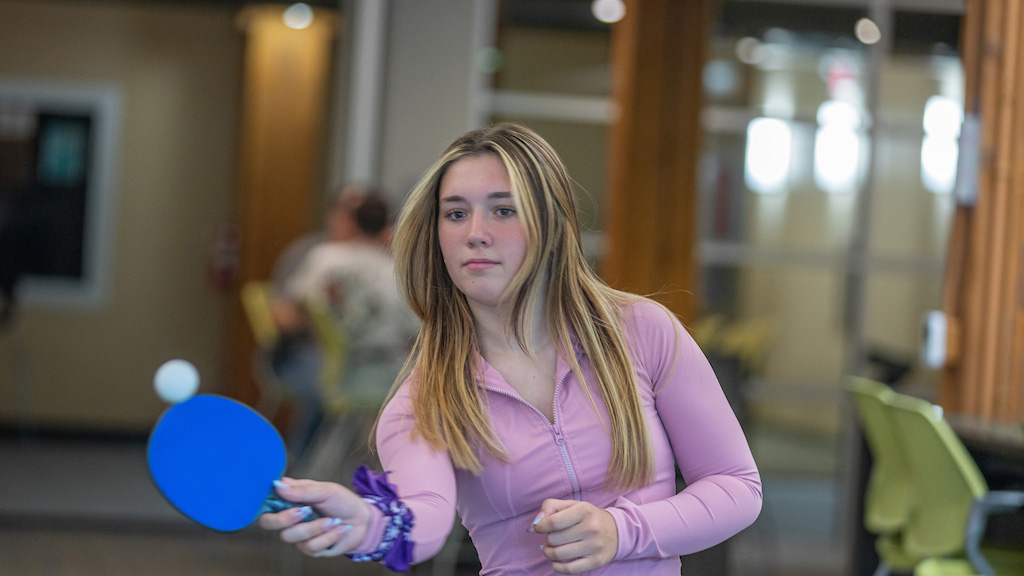 Providence orientation women student playing ping pong